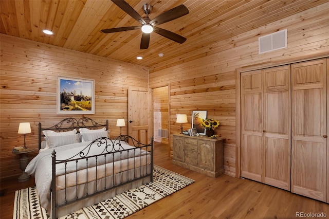 bedroom with visible vents, wood walls, recessed lighting, wooden ceiling, and wood finished floors