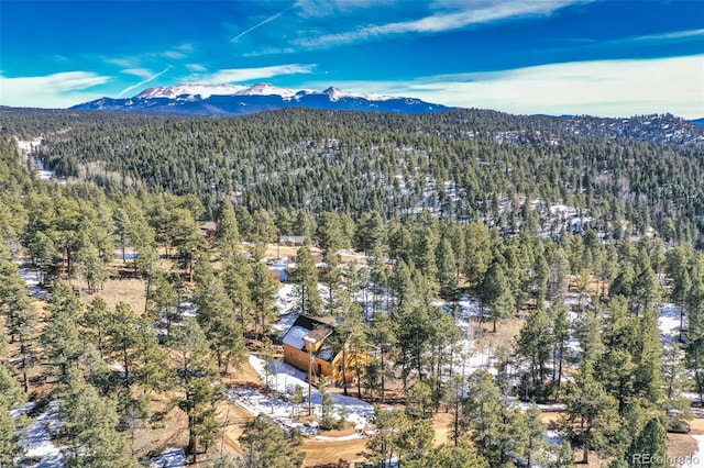 aerial view featuring a mountain view and a forest view