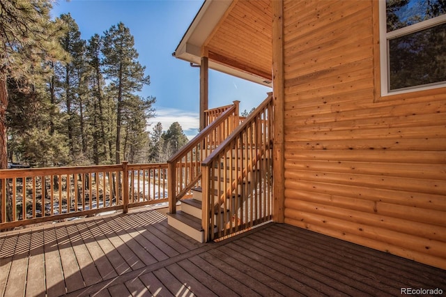 wooden terrace featuring stairway