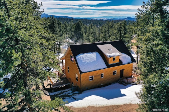 birds eye view of property featuring a view of trees