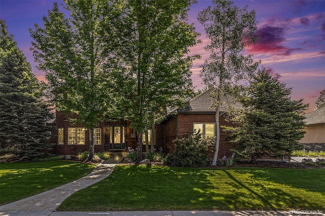6940 Saddleback Ave, Firestone, CO 80504 - obstructed view of property with a lawn and brick siding
