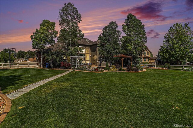 6940 Saddleback Ave, Firestone, CO 80504 - back of property with a lawn and a gazebo