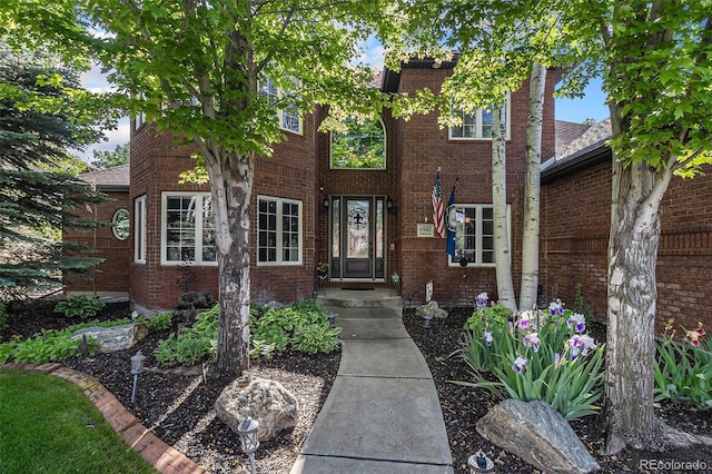 6940 Saddleback Ave, Firestone, CO 80504 - property entrance featuring brick siding
