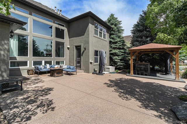 6940 Saddleback Ave, Firestone, CO 80504 - view of patio / terrace featuring an outdoor living space with a fire pit and a gazebo