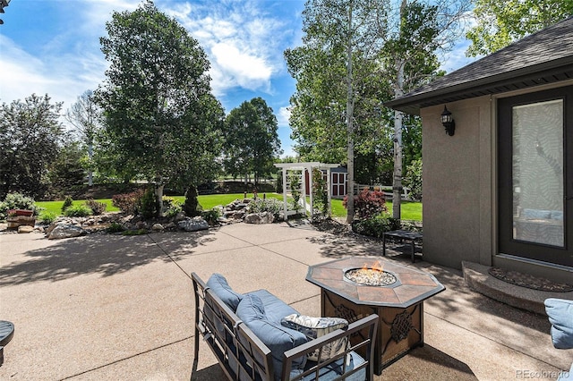 6940 Saddleback Ave, Firestone, CO 80504 - view of patio / terrace with a fire pit
