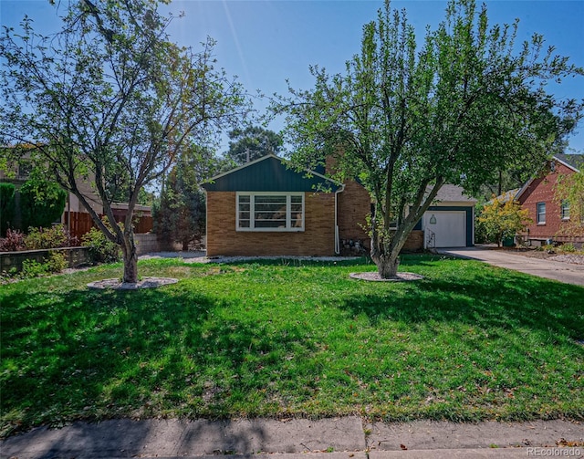 ranch-style home with a garage and a front yard