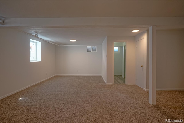 basement with light colored carpet