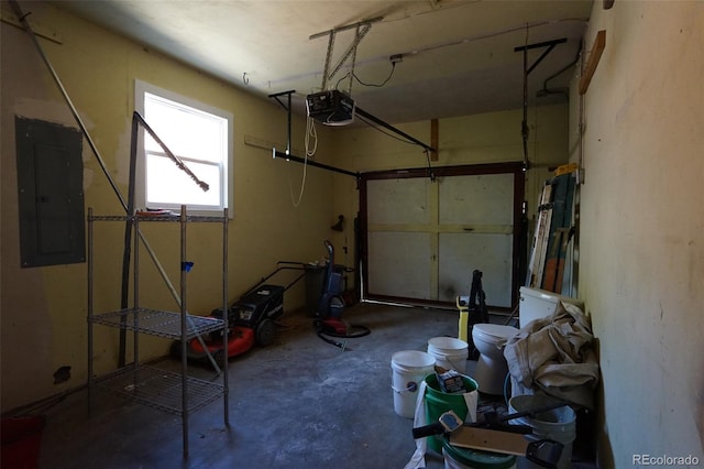 garage featuring a garage door opener and electric panel