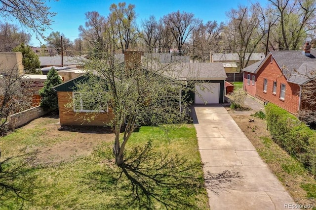 view of front facade featuring a garage and a front lawn