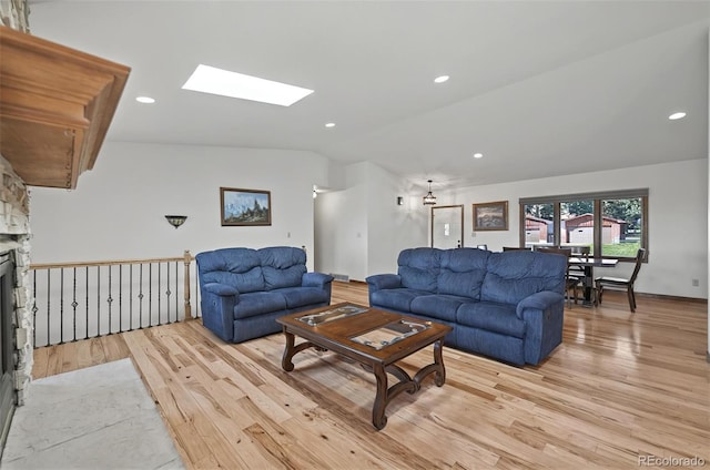 723 Orion Dr, Colorado Springs, CO 80906 - living area featuring lofted ceiling, light wood-style floors, a skylight, and recessed lighting