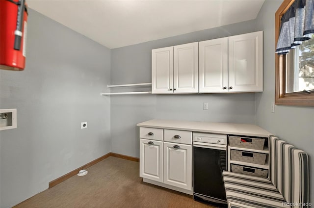 723 Orion Dr, Colorado Springs, CO 80906 - laundry room featuring hookup for a washing machine, baseboards, and light carpet