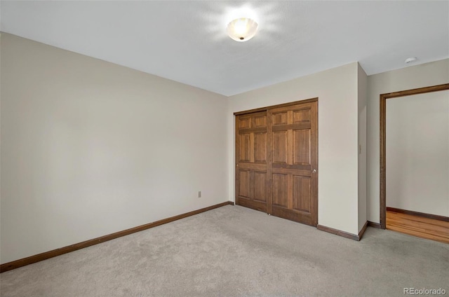 723 Orion Dr, Colorado Springs, CO 80906 - unfurnished bedroom with light colored carpet, baseboards, and a closet