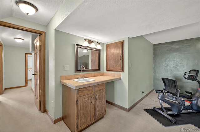 723 Orion Dr, Colorado Springs, CO 80906 - bathroom with vanity, baseboards, and a textured ceiling