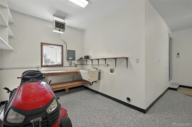 723 Orion Dr, Colorado Springs, CO 80906 - garage with a heating unit, baseboards, a sink, and electric panel