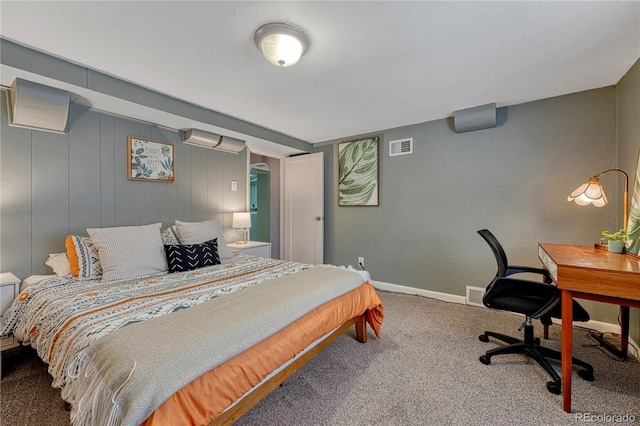 bedroom featuring carpet, an office area, and baseboards