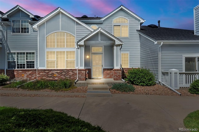 3026 S Waco Ct, Aurora, CO 80013 - view of front of house featuring brick siding and roof with shingles