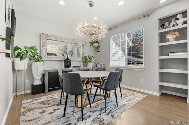 3026 S Waco Ct, Aurora, CO 80013 - dining area featuring a chandelier, wood finished floors, and recessed lighting