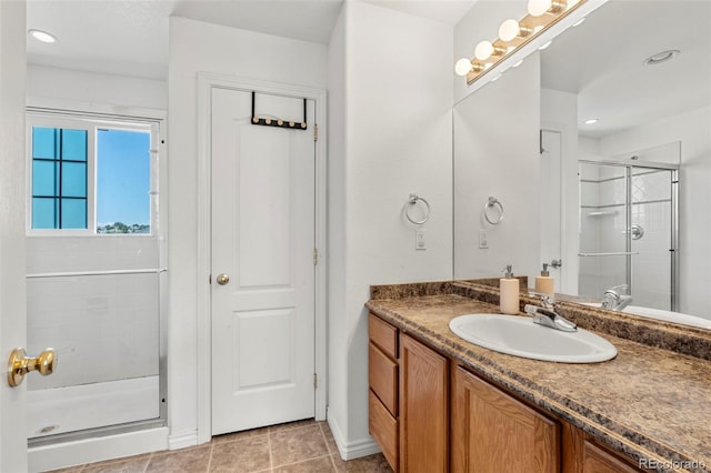 3026 S Waco Ct, Aurora, CO 80013 - full bath with vanity, a shower stall, tile patterned floors, and recessed lighting