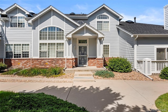 3026 S Waco Ct, Aurora, CO 80013 - view of front facade featuring brick siding and roof with shingles