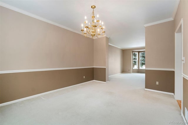 empty room with light carpet, ornamental molding, a notable chandelier, and baseboards