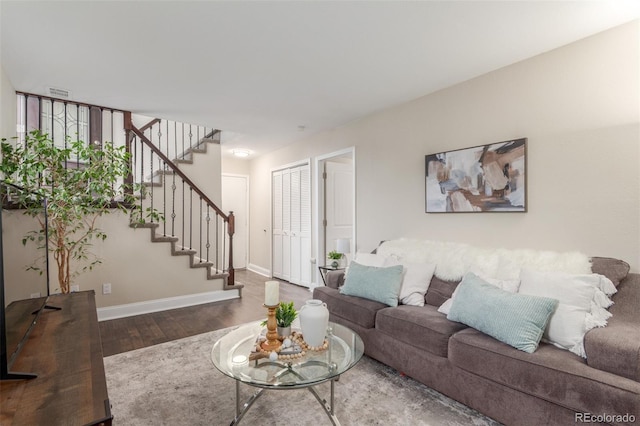 10370 Routt St, Westminster, CO 80021 - living area featuring wood finished floors, stairs, and baseboards