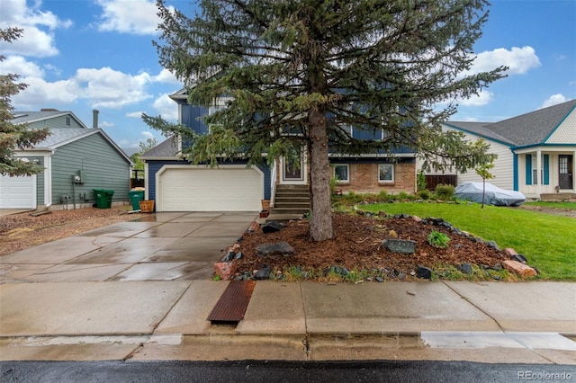 10370 Routt St, Westminster, CO 80021 - view of property hidden behind natural elements featuring concrete driveway, an attached garage, brick siding, and a front yard