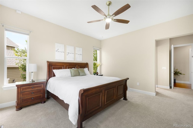 15779 W 83rd Pl, Arvada, CO 80007 - bedroom with light colored carpet, baseboards, and a ceiling fan