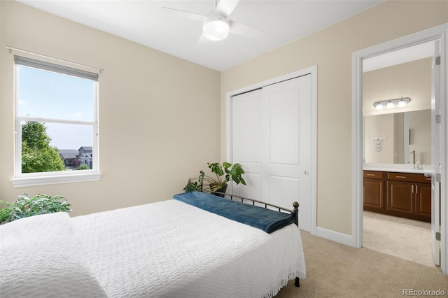 15779 W 83rd Pl, Arvada, CO 80007 - bedroom with a closet, light carpet, wet bar, ceiling fan, and baseboards