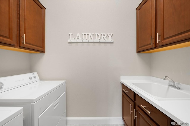 15779 W 83rd Pl, Arvada, CO 80007 - washroom with cabinet space, washing machine and clothes dryer, and baseboards