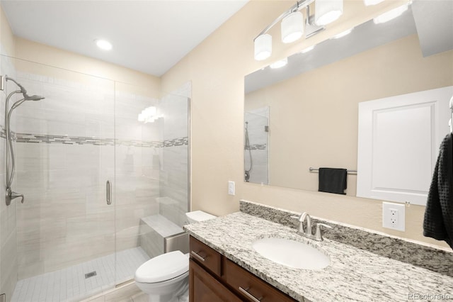 15779 W 83rd Pl, Arvada, CO 80007 - bathroom with vanity, toilet, and a stall shower