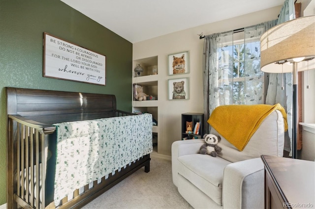 bedroom featuring baseboards and light colored carpet