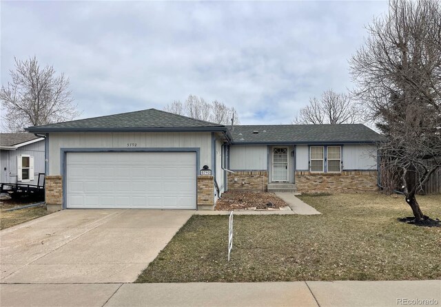 ranch-style house with an attached garage, concrete driveway, brick siding, and roof with shingles