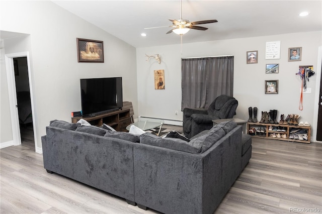 living room featuring a baseboard heating unit, a ceiling fan, vaulted ceiling, and wood finished floors