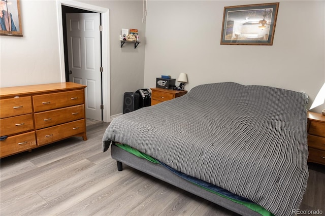 bedroom with light wood finished floors