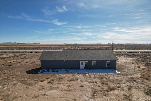 rear view of house with a rural view