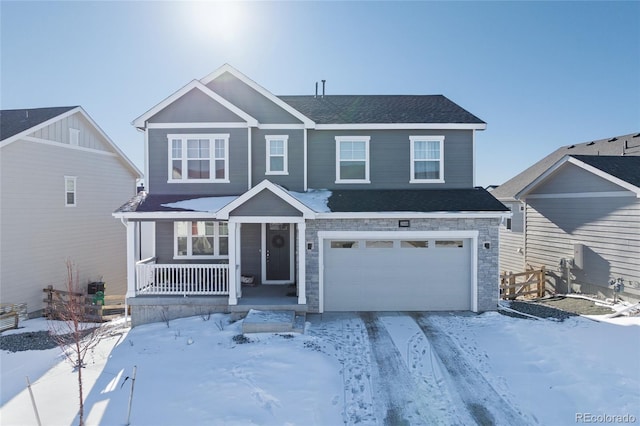 view of front of house with a garage and a porch