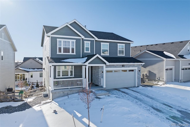 view of front of property with a garage and a porch