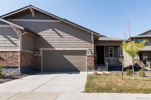 view of front of home featuring a garage and a porch