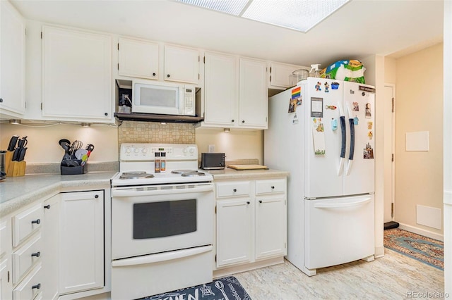 kitchen with light countertops, white appliances, white cabinetry, and decorative backsplash