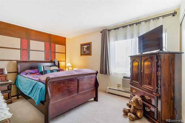 carpeted bedroom with a baseboard radiator and a textured ceiling