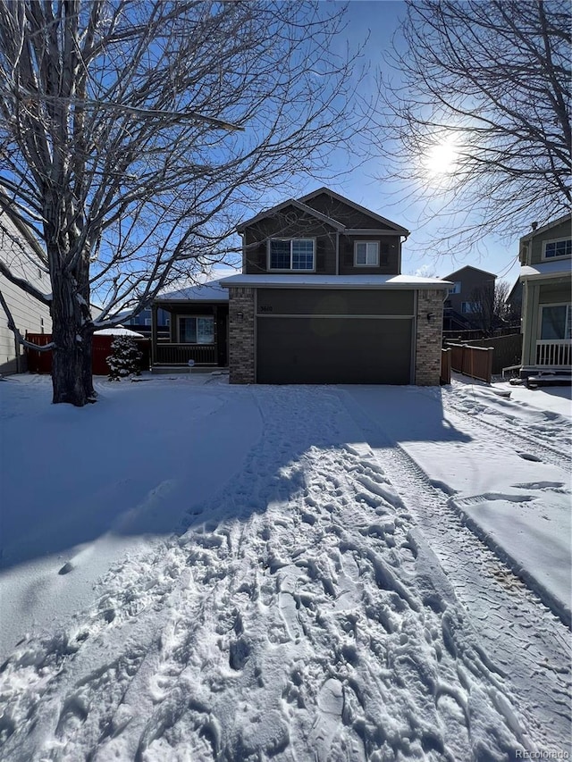 view of front of property with a garage and fence