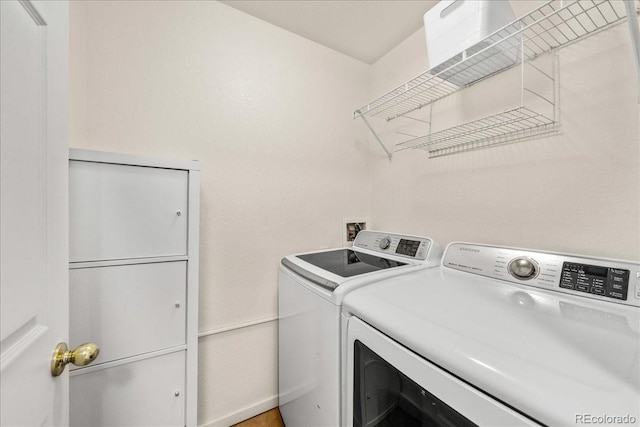 21562 E 47th Ave, Denver, CO 80249 - clothes washing area with washing machine and clothes dryer and laundry area