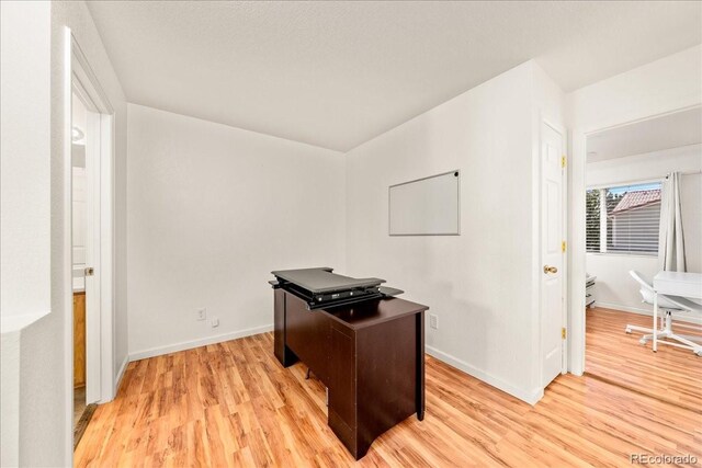 21562 E 47th Ave, Denver, CO 80249 - office featuring baseboards and light wood-style floors