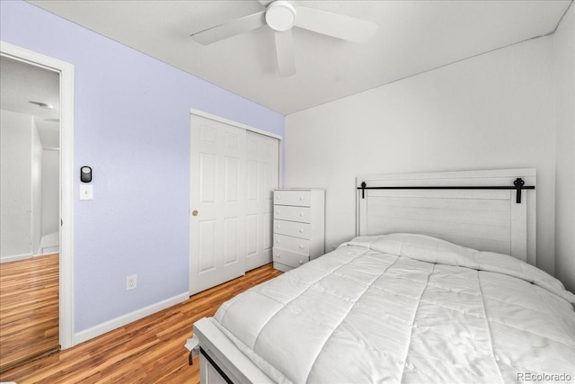 21562 E 47th Ave, Denver, CO 80249 - bedroom featuring a closet, wood finished floors, baseboards, and ceiling fan