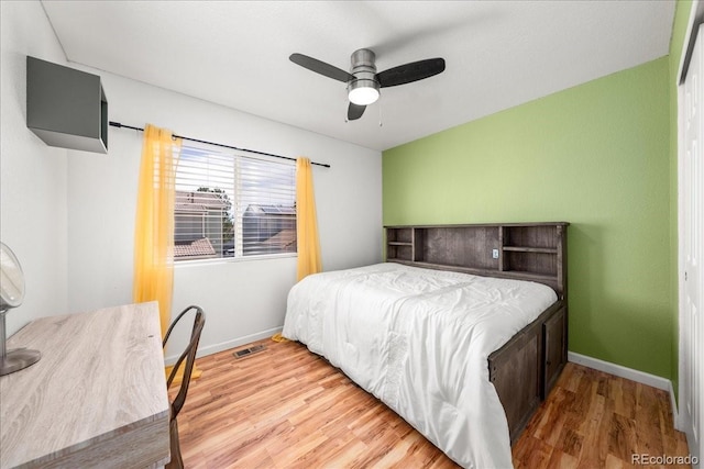 21562 E 47th Ave, Denver, CO 80249 - bedroom featuring baseboards, ceiling fan, visible vents, and wood finished floors