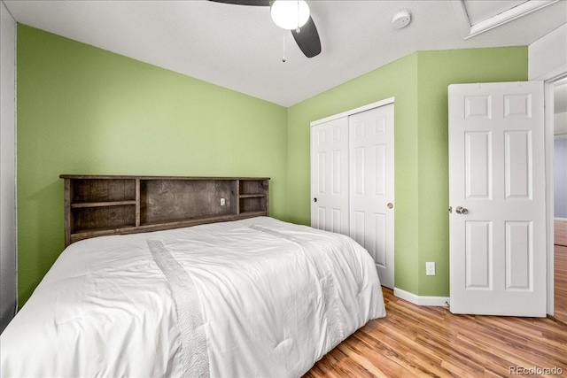 21562 E 47th Ave, Denver, CO 80249 - bedroom with a closet, wood finished floors, baseboards, and ceiling fan