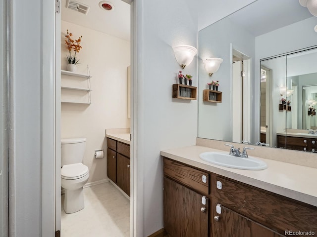 4273 W Ponds Cir, Littleton, CO 80123 - bathroom with toilet, vanity, and baseboards