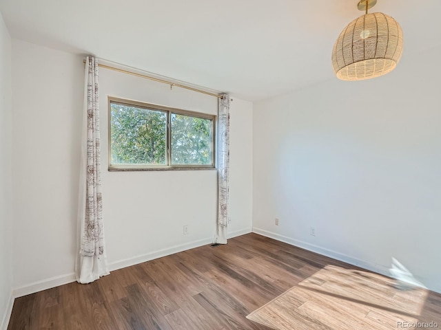 4273 W Ponds Cir, Littleton, CO 80123 - unfurnished room with wood finished floors and baseboards