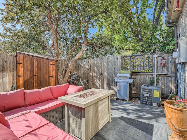4273 W Ponds Cir, Littleton, CO 80123 - view of patio / terrace featuring a grill, an outdoor living space with a fire pit, cooling unit, and a fenced backyard