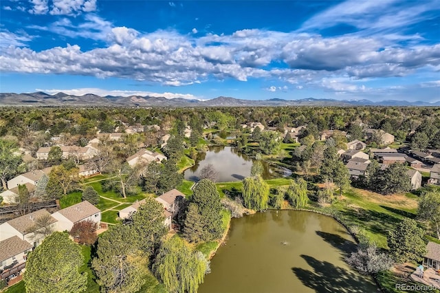 4273 W Ponds Cir, Littleton, CO 80123 - aerial view of residential area with a water and mountain view